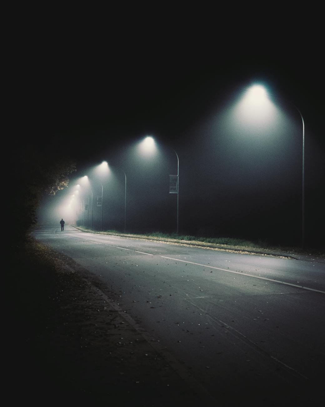 alone; wide road with street lights